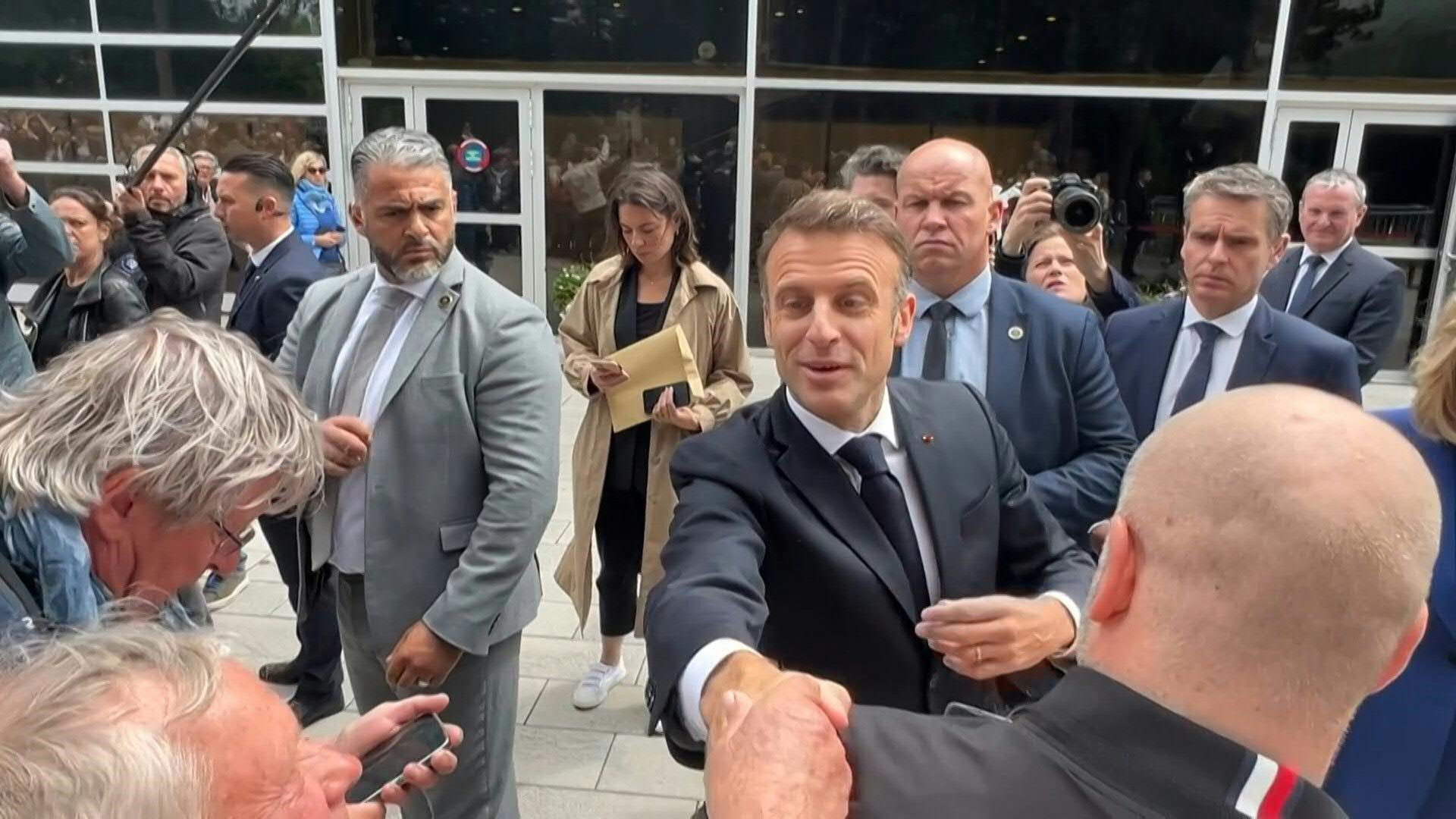 Elections : Emmanuel and Brigitte Macron greet residents after voting