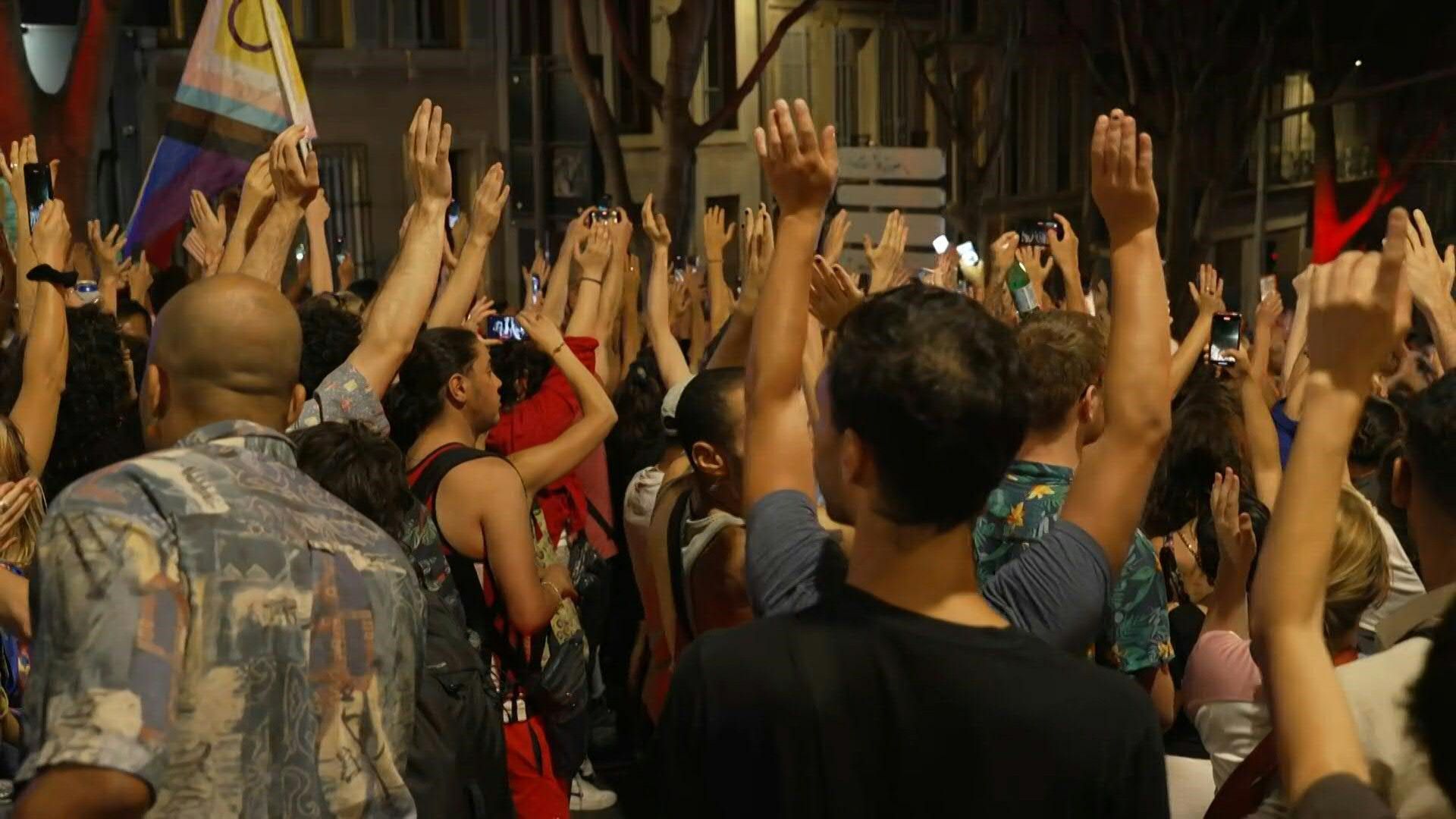 Demonstrators in Marseille celebrate the results of the French general elections