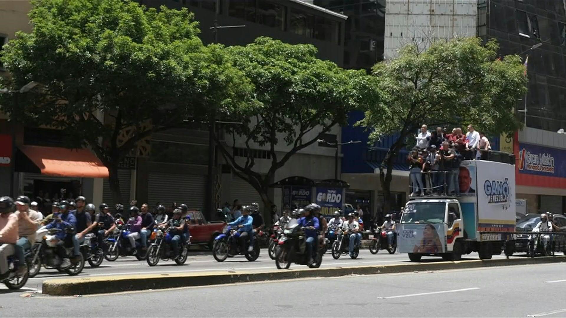 Venezuelan opposition members rally atop a truck after Maduro win ratified
