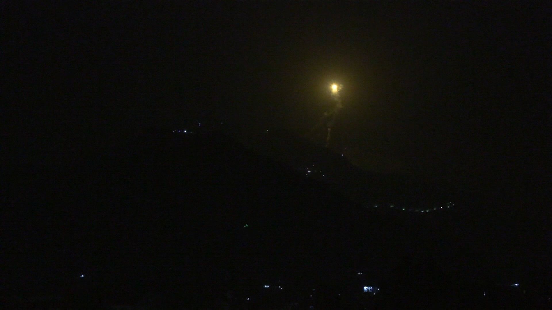 Flare lights up sky in India-administered Kashmir as India launches strikes on Pakistan