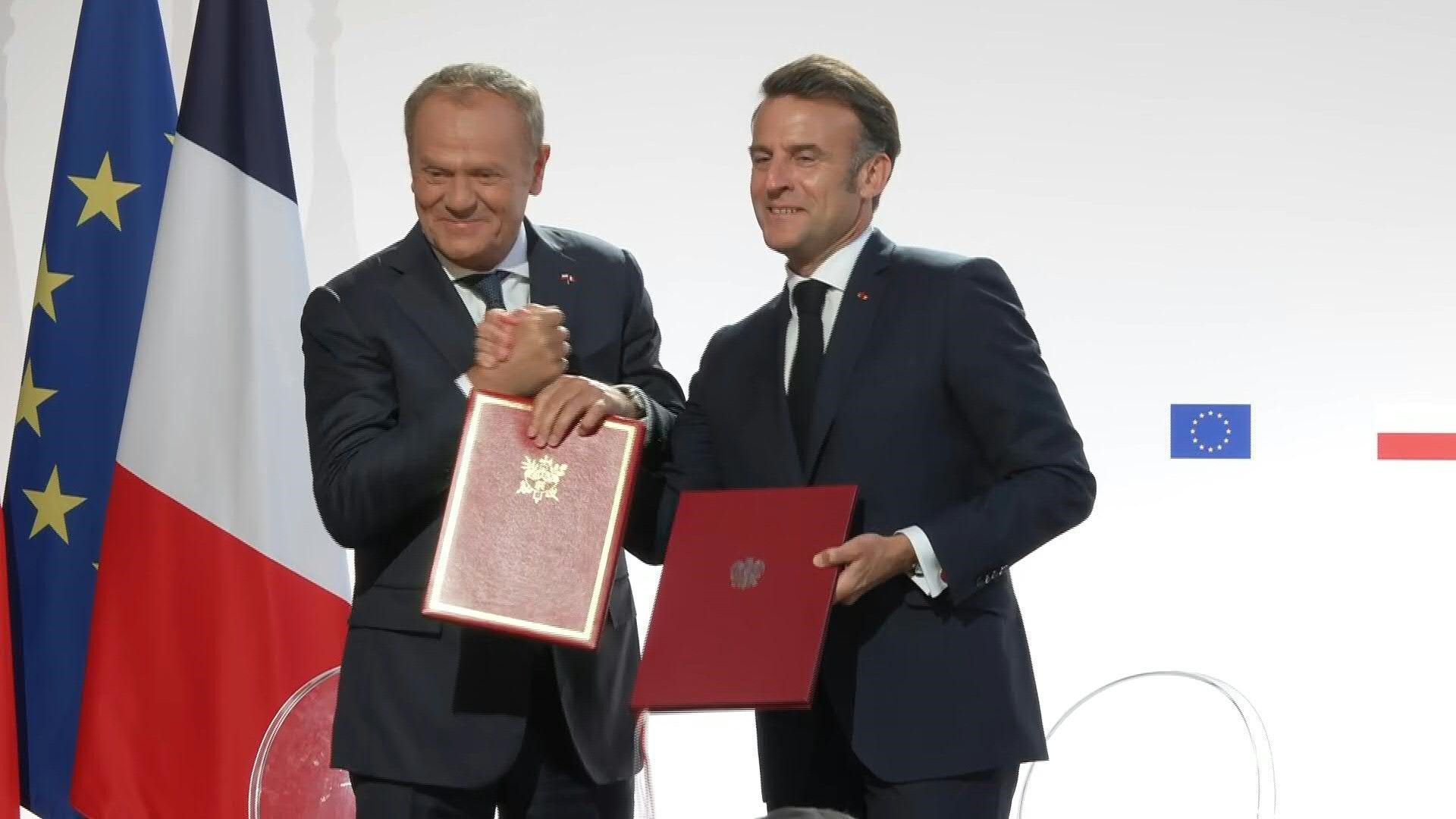 Macron, Tusk sign France-Poland treaty with mutual defence clause