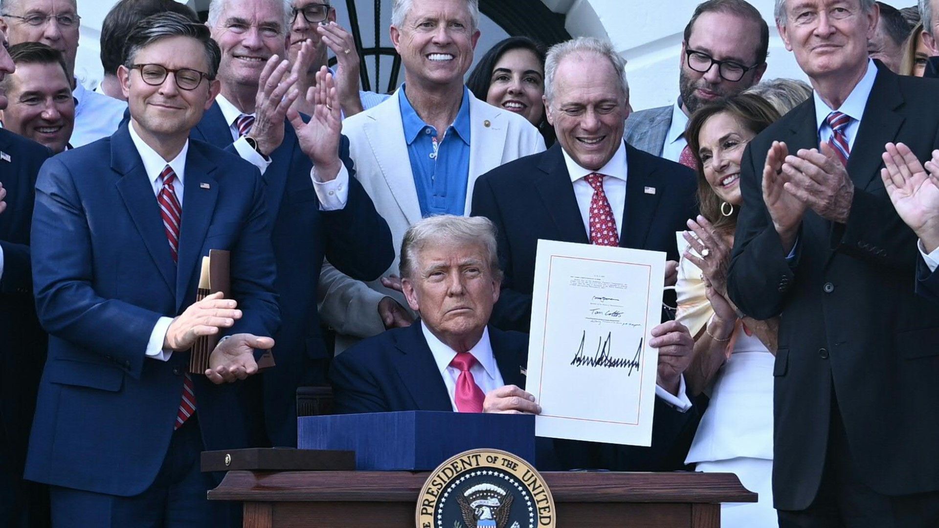 Trump signs his 