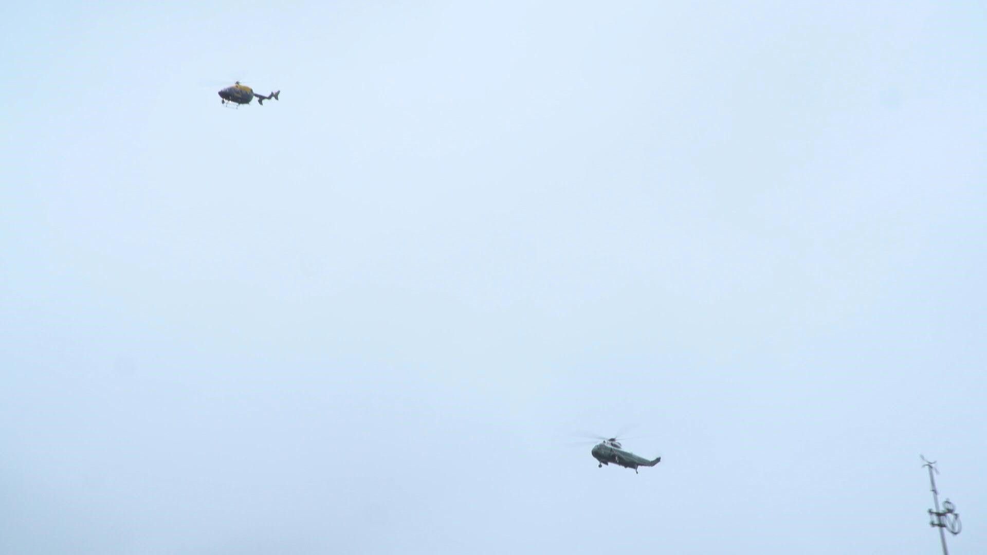Helicopters including Marine One carrying Trump fly past Windsor Castle
