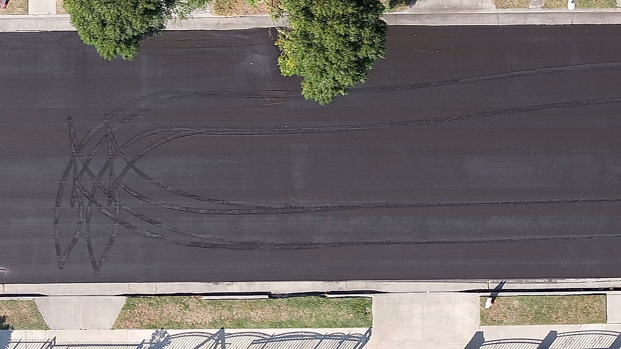 Mystery culprit ruins freshly-laid road