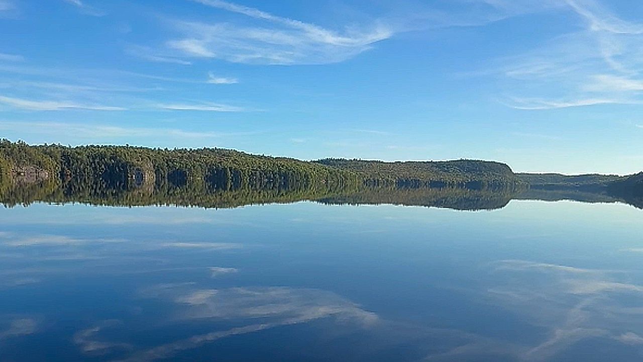 Calm lake in Canada creates mirror-like reflection