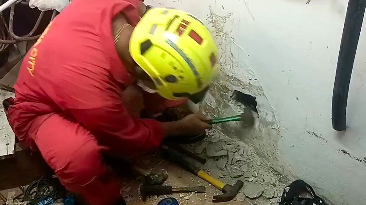 Video: Firefighters break through wall for an dramatic rescue