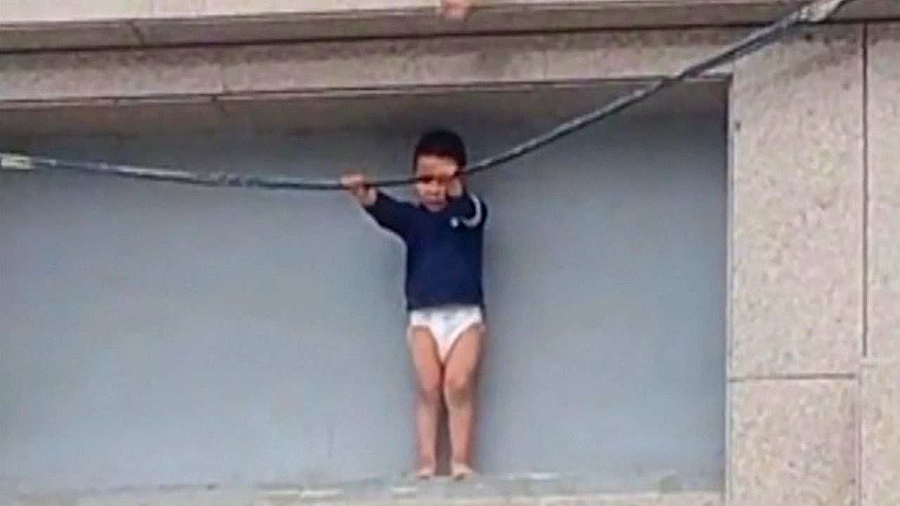 Video: Toddler rescued from narrow ledge after terrifying rooftop ordeal