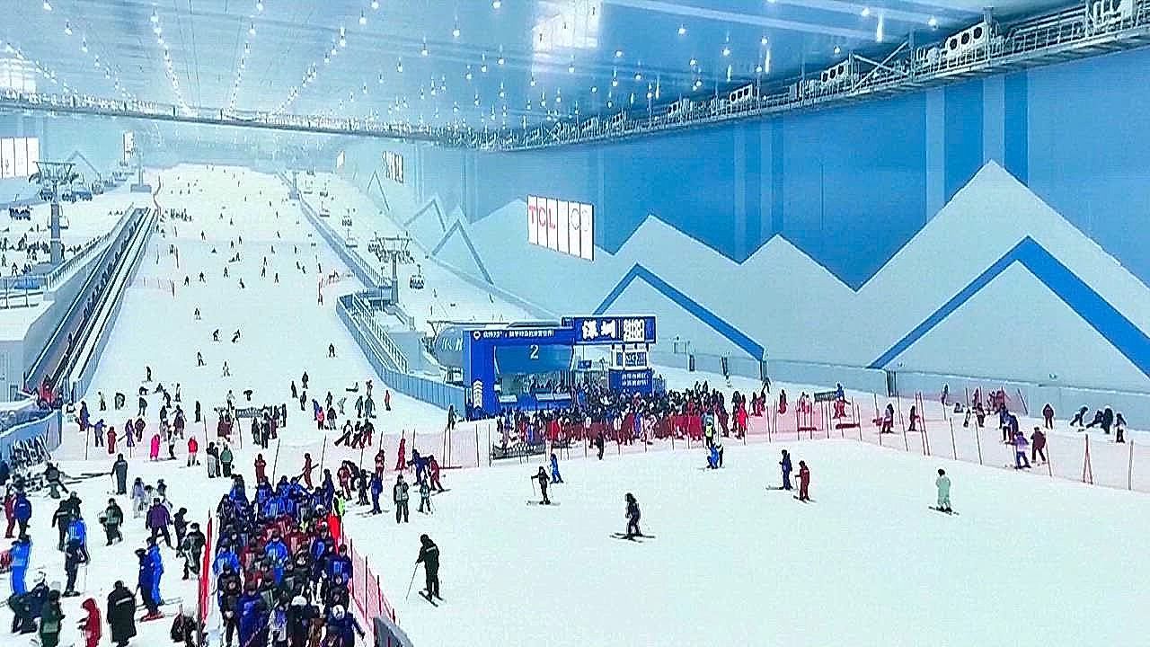 Video: In the middle of summer China cools of in the world's largest indoor snow facility