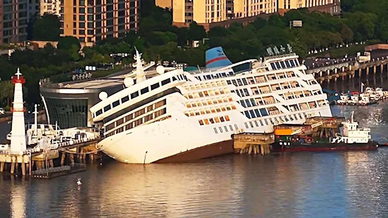Decommissioned cruise ship capsizes during high tide at Chinese waterfront