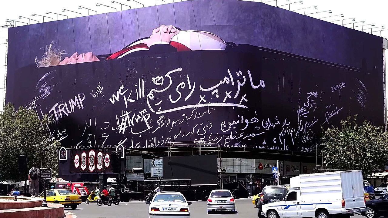 Video: Giant poster depicting Trump in coffin displayed at central square in Tehran