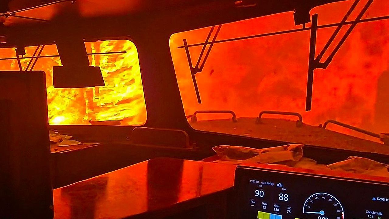 Video: Dramatic moment Canadian freight train surrounded by wildfire in Ontario