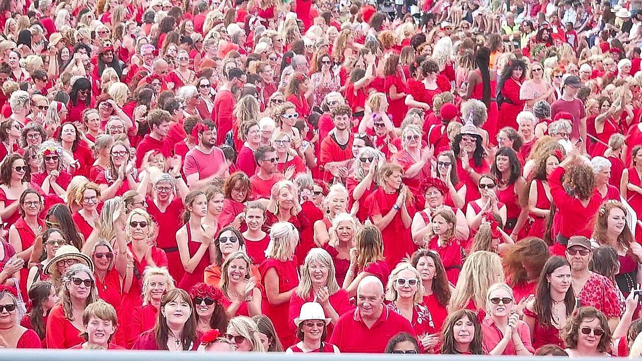 Hundreds of Kate Bush fans in red recreate her iconic Wuthering Heights video
